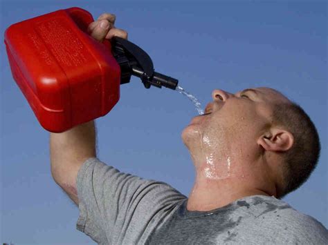 Some dude is drinking gasoline