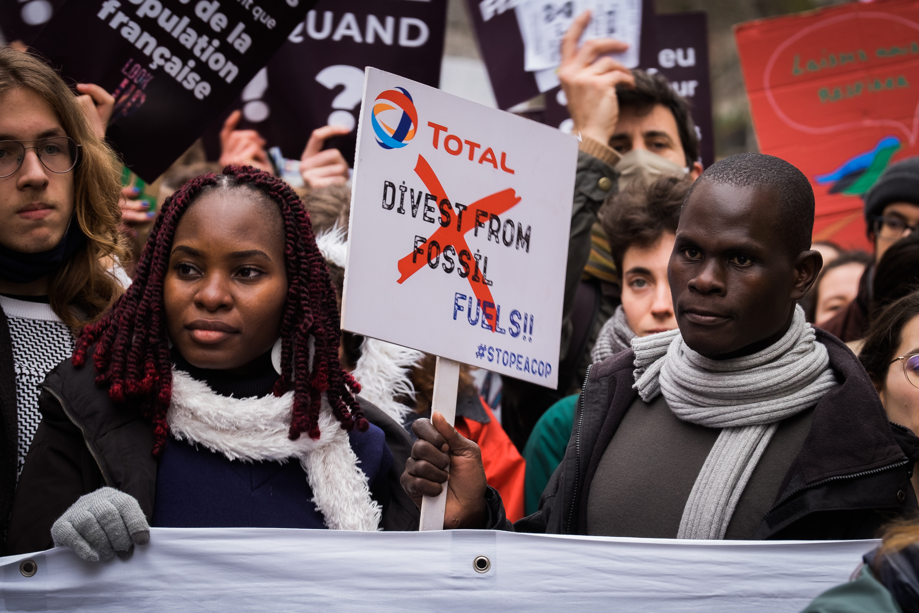 A delegation of Ugandan activists joins the STOP EACOP block at the Look UP climate march in Paris, France to denounce Total's climate wrecking project.