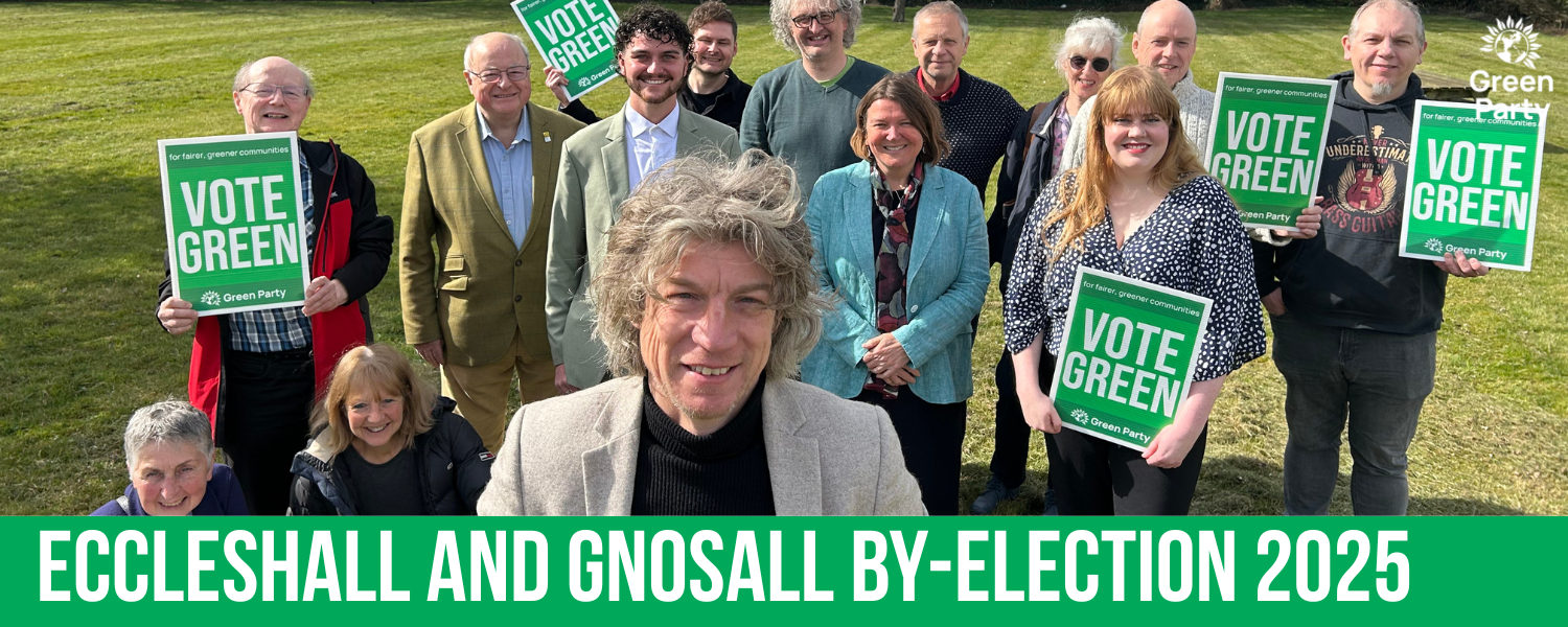 Image of a group of people holding "Vote Green" posters and the words "Eccleshall and Gnosall By-Election 2025"