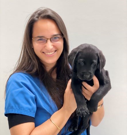 Gita Gnanadesikan holding a puppy