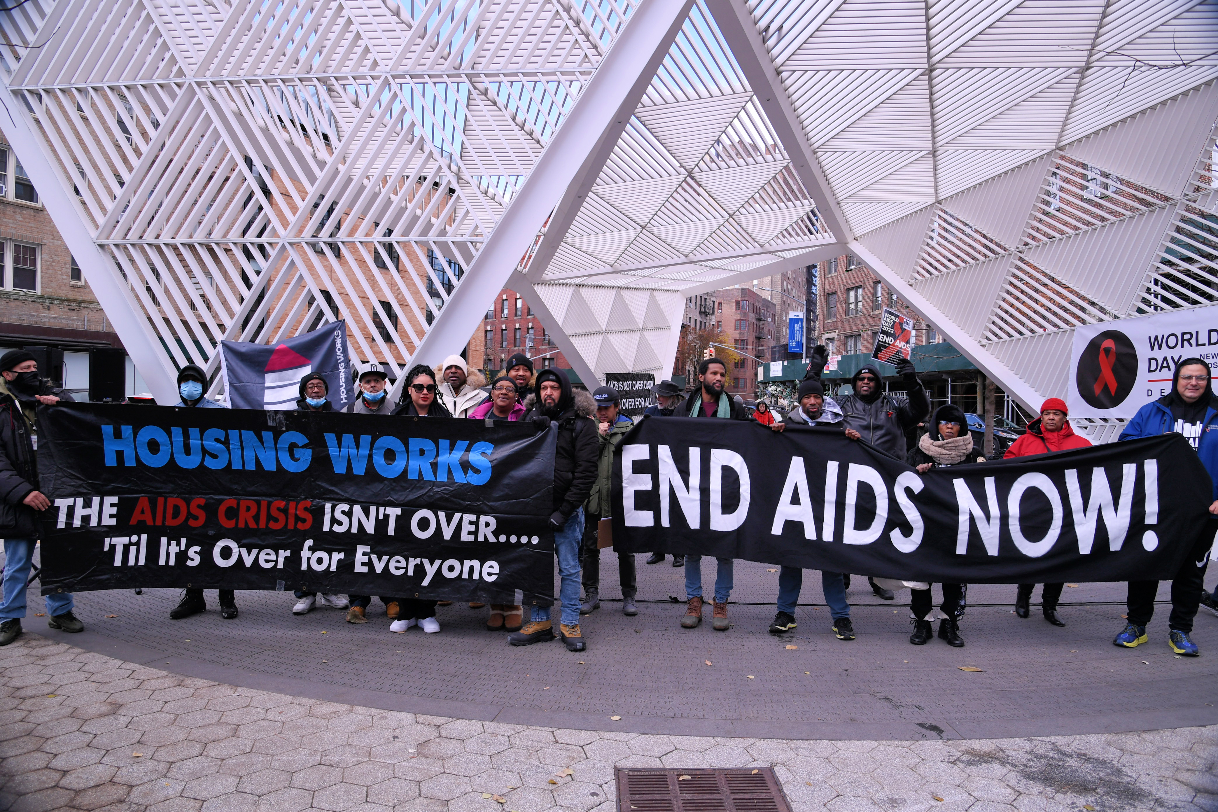 People Holding Banners at NYC AIDS Memorial on December 1, 2022