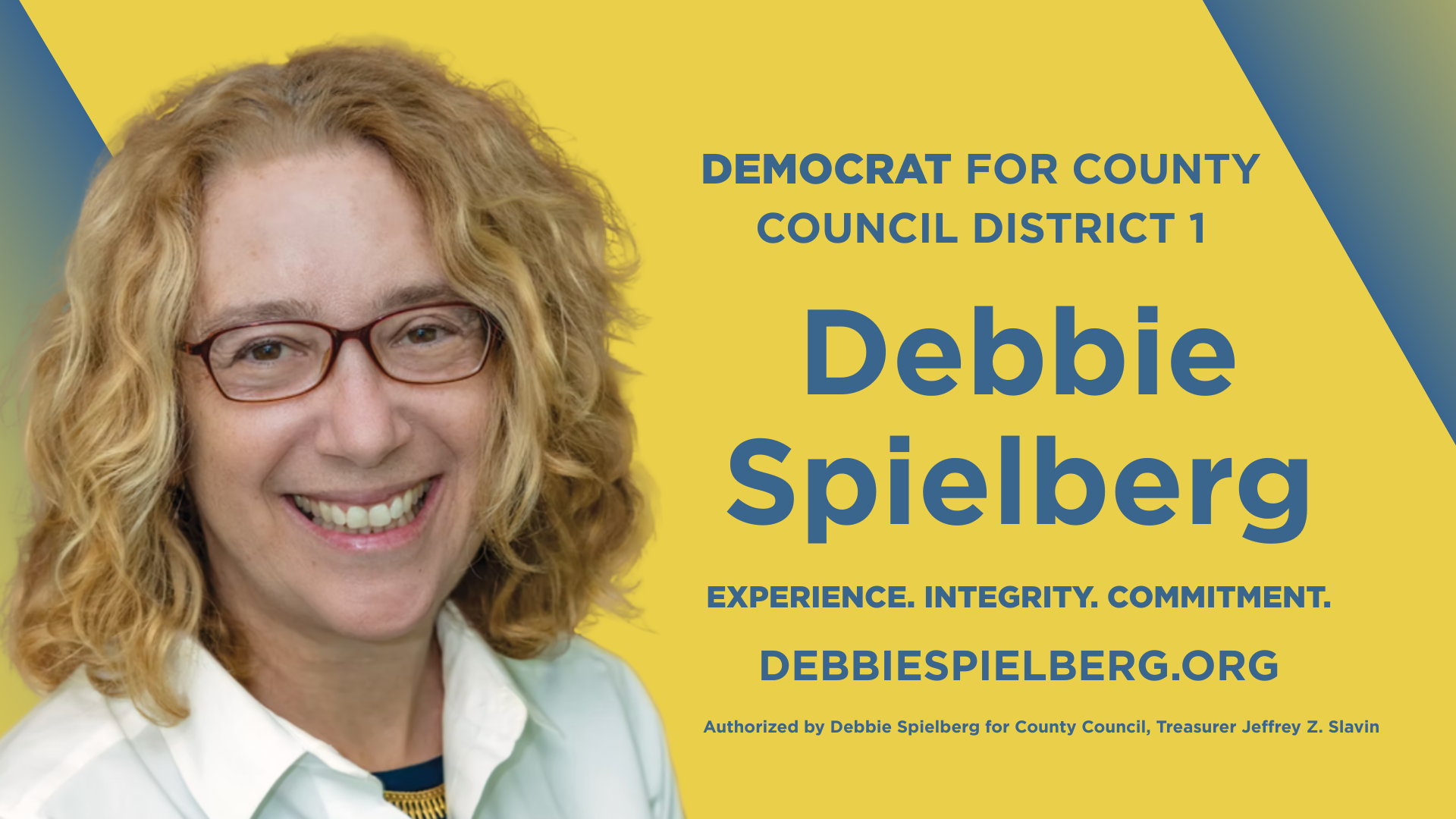 Photo of Debbie, a blonde, white woman wearing glasses, with a yellow and blue background and text that reads: Democrat for County Council District 1 Debbie Spielberg. Experience, Integrity, Commitment. DebbieSpielberg.org.