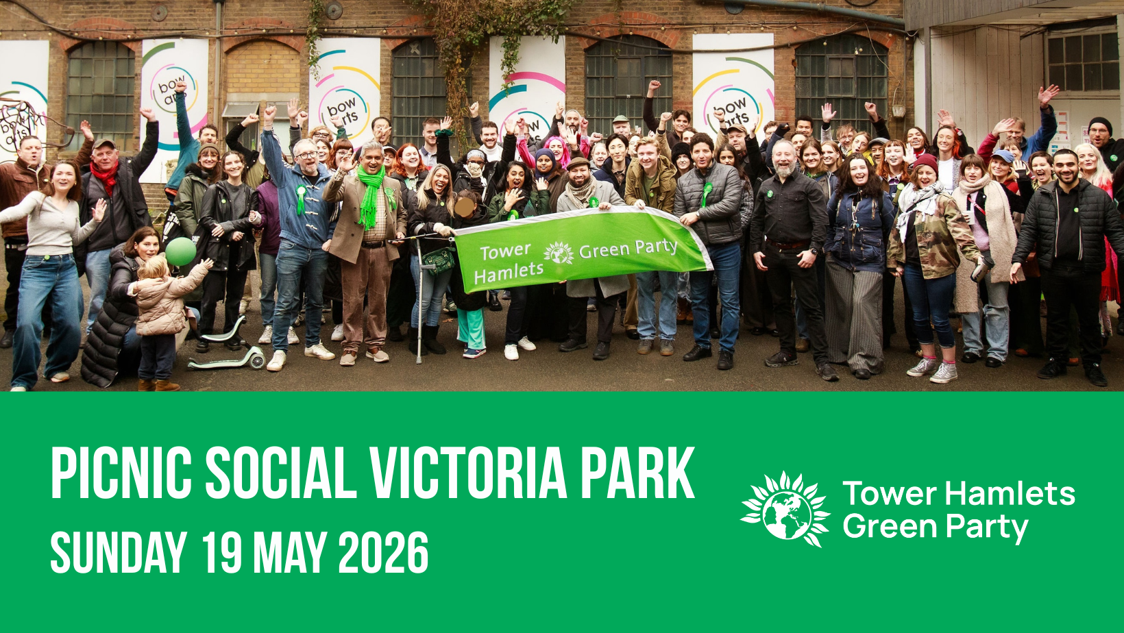 Large crowd of members holding a large banner that says Tower Hamlets Green Party