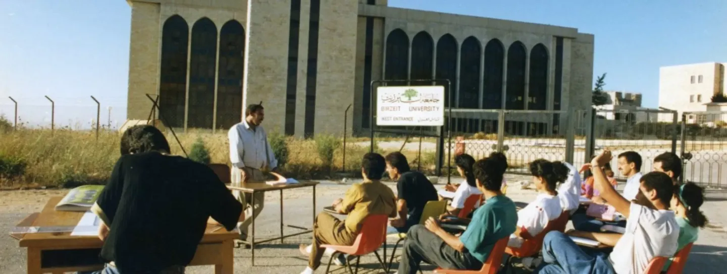 Teaching at the gates of Birzeit University during the First Intifada