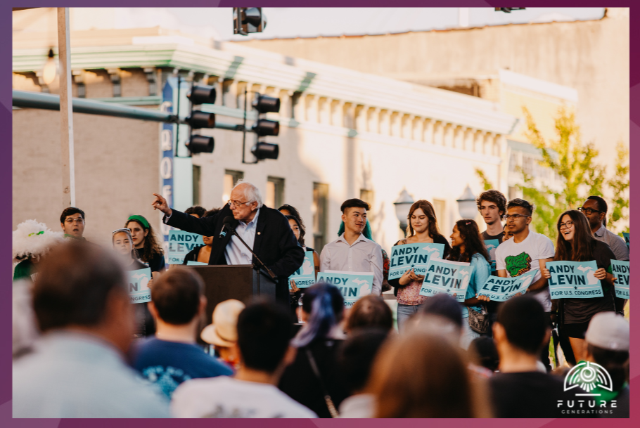 Bernie Sanders speaking at Michigan rally for Andy Levi. Young supporters cheer.