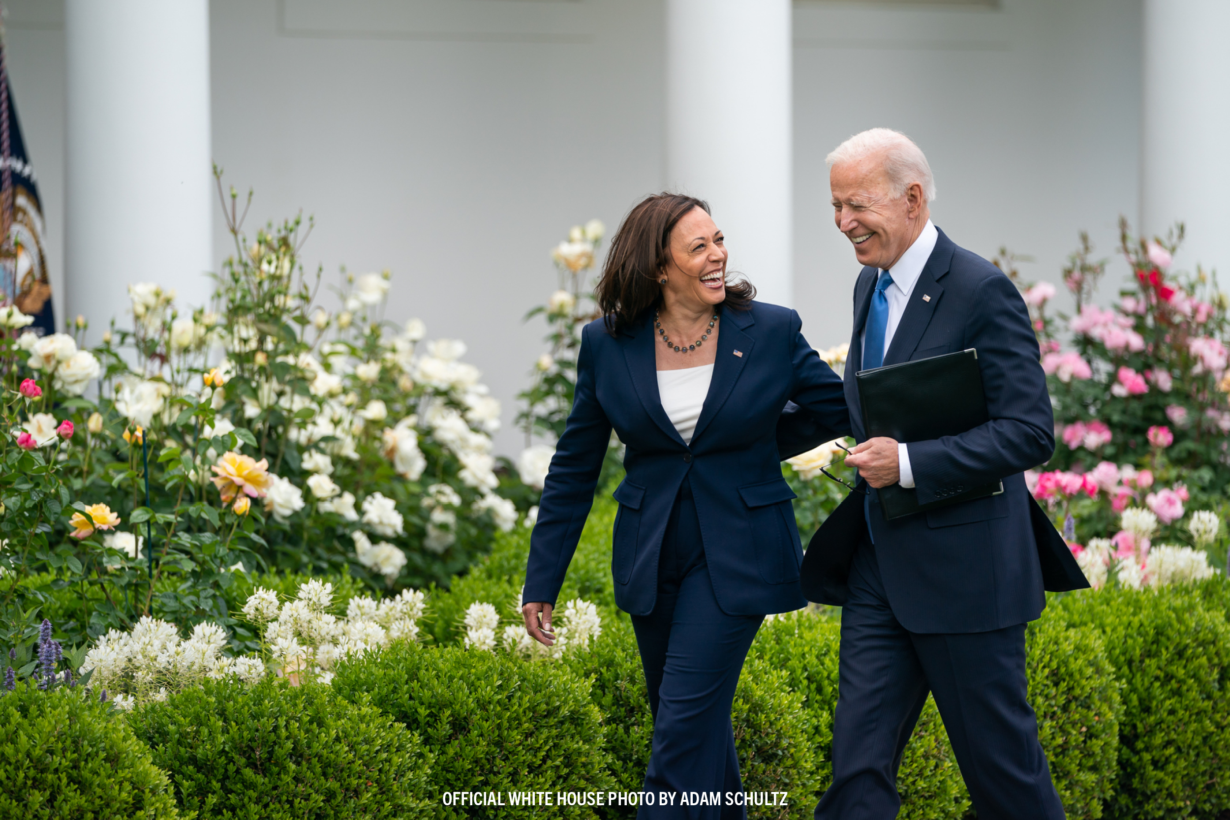 President Biden and Vice President Harris smiling and walking together