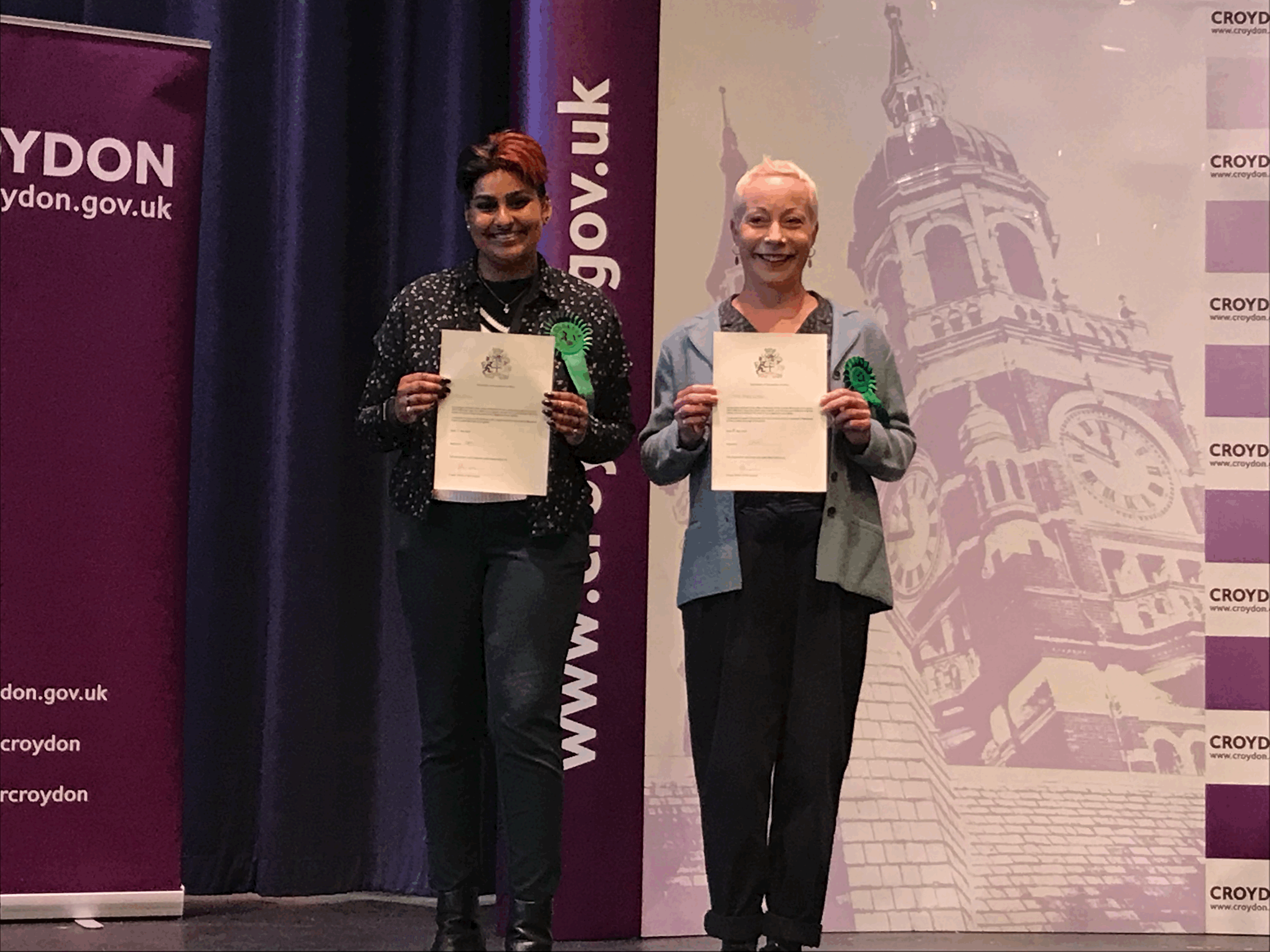 Picture of Ria and Esther having just been elected smiling and holding their declarations