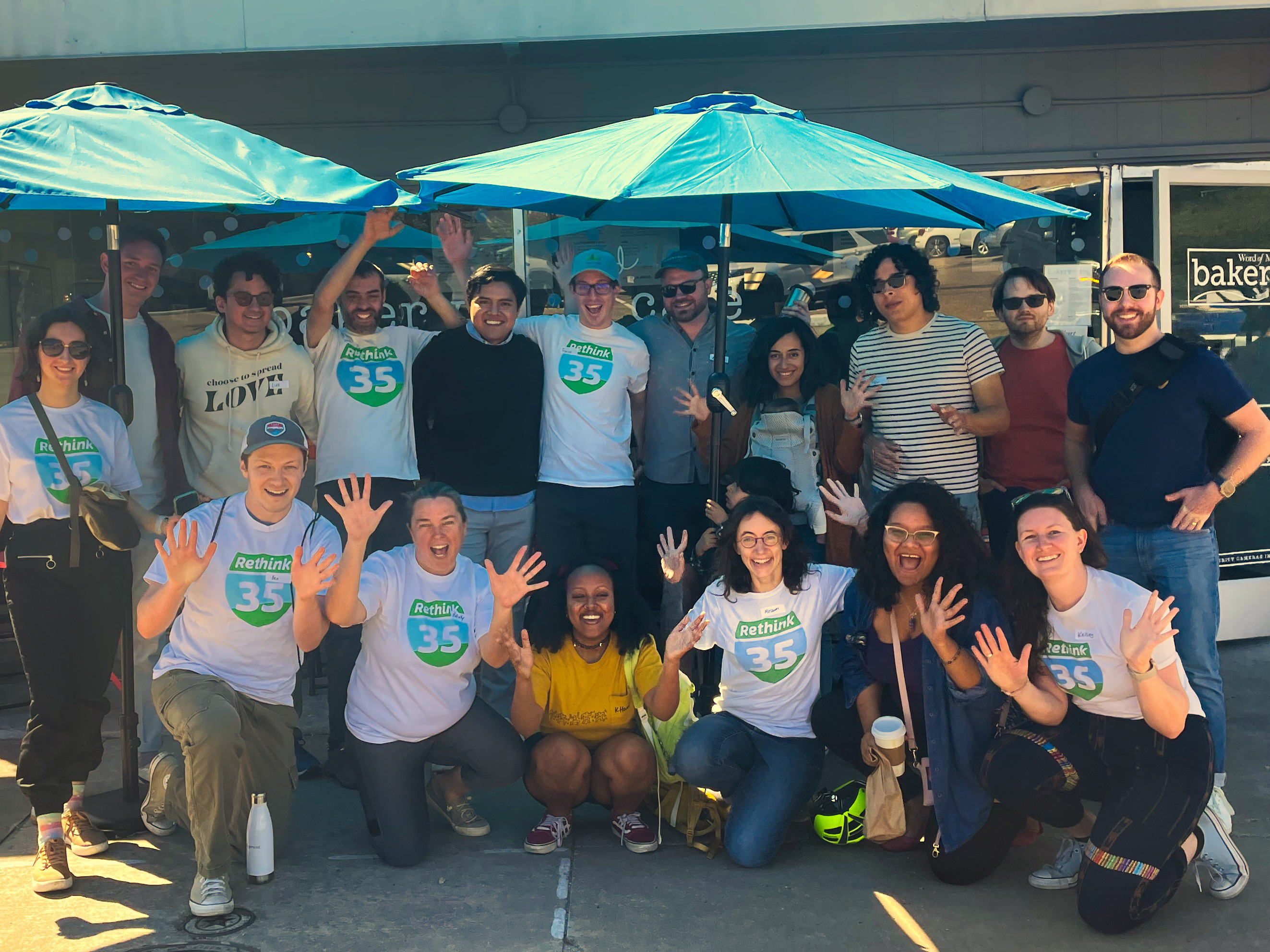 Group of people with rethink35 shirts smiling