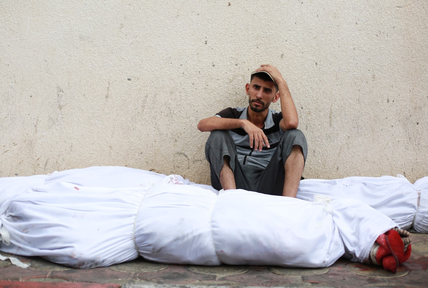A Palestinian in Gaza grieves those killed by Israel.