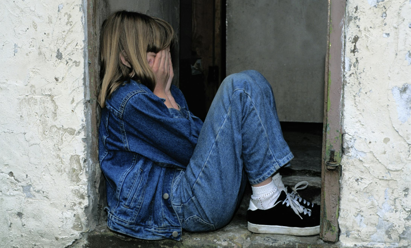 Child crying in doorway