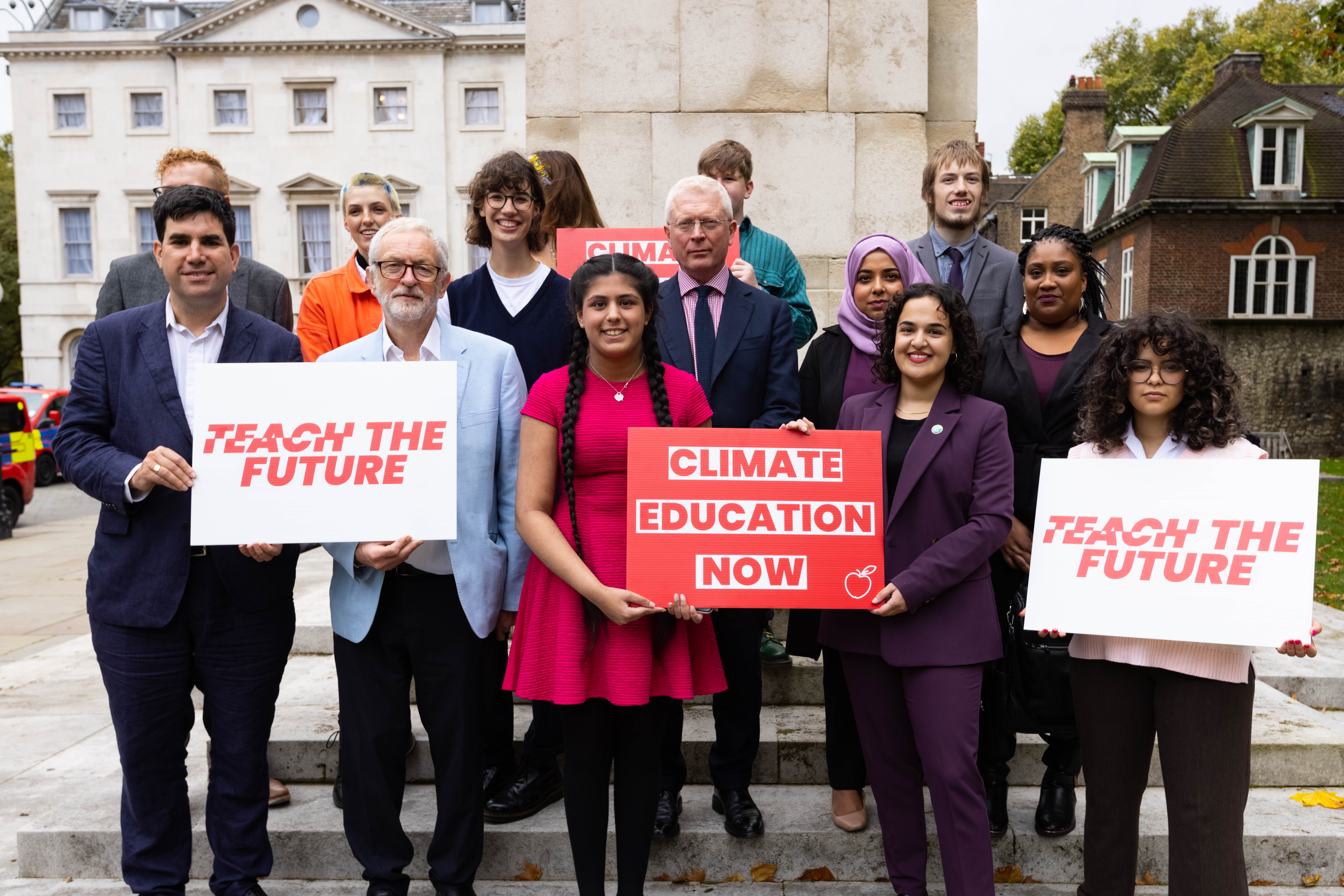 Teach the Future Members holding up banners in protest of current climate education.
