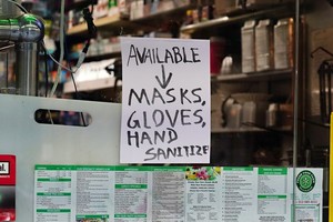 A_sign_displayed_on_a_deli_during_the_coronavirus_pandemic_on_May_10__2020_in_New_York_City_(Photo_by_Cindy_Ord_Getty_Images)