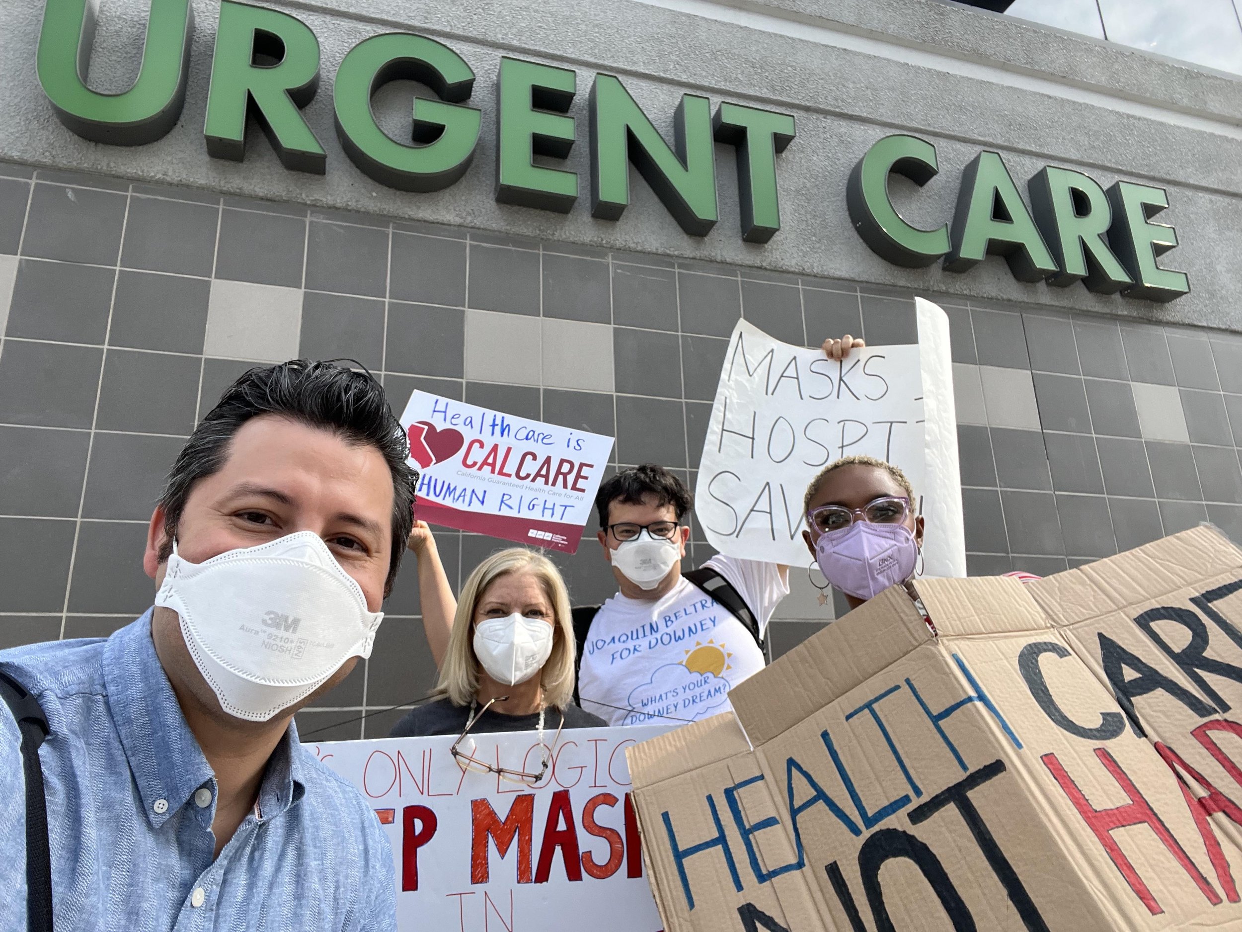 Community members protesting to keep masks in healthcare