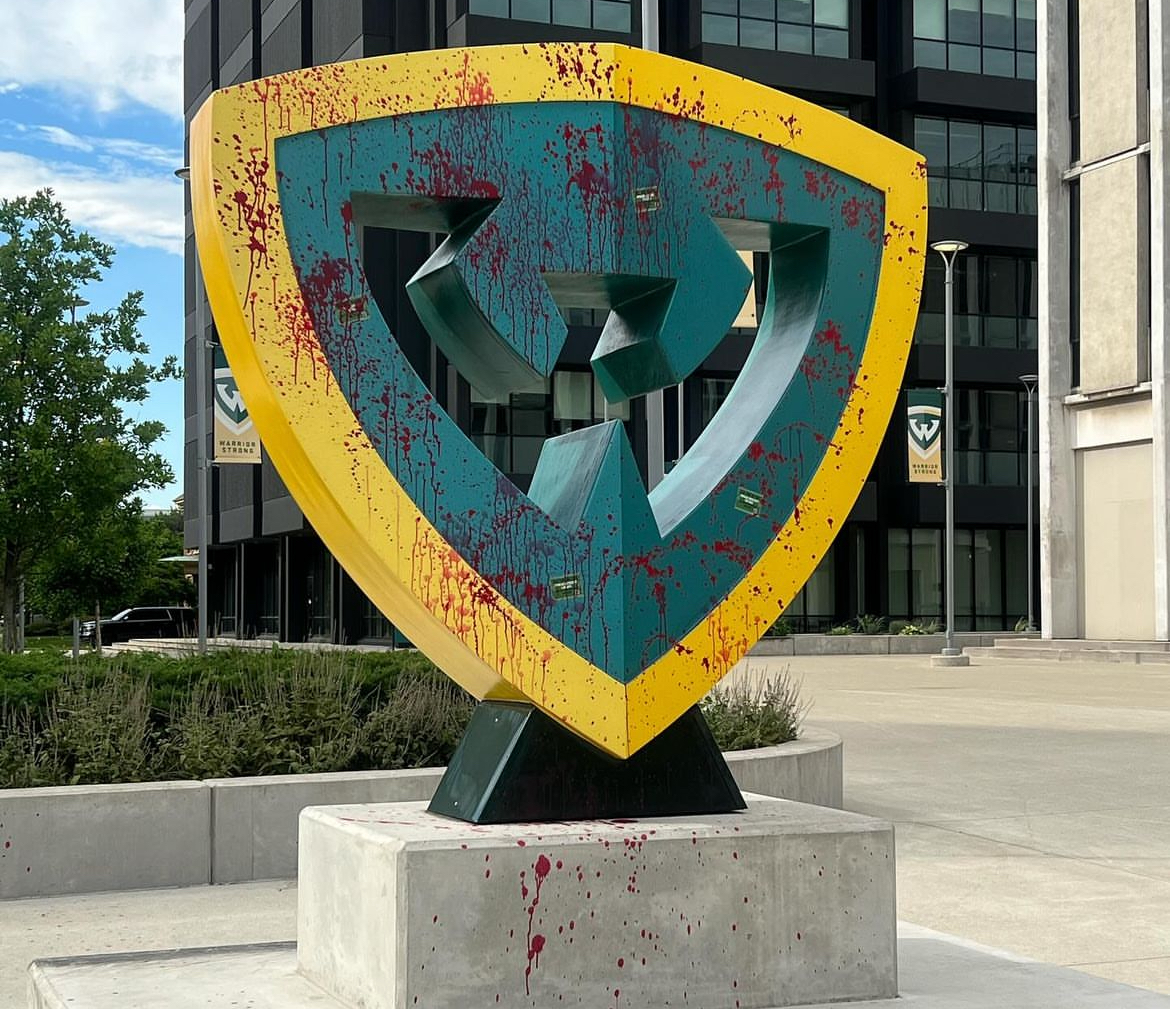 The Wayne State "W" monument on campus stained red with complicity in the murder of innocent lives through the schools investments in genocide-profiting companies