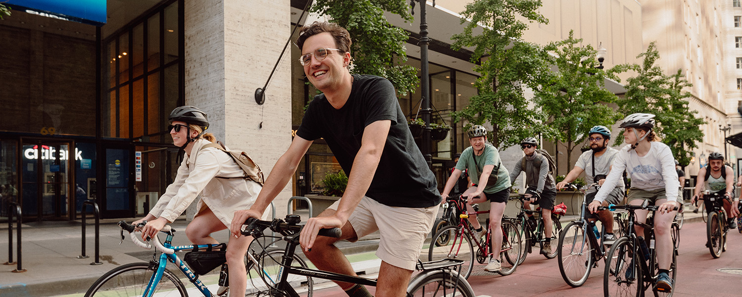 Cyclists happily riding during a Critical Mass event