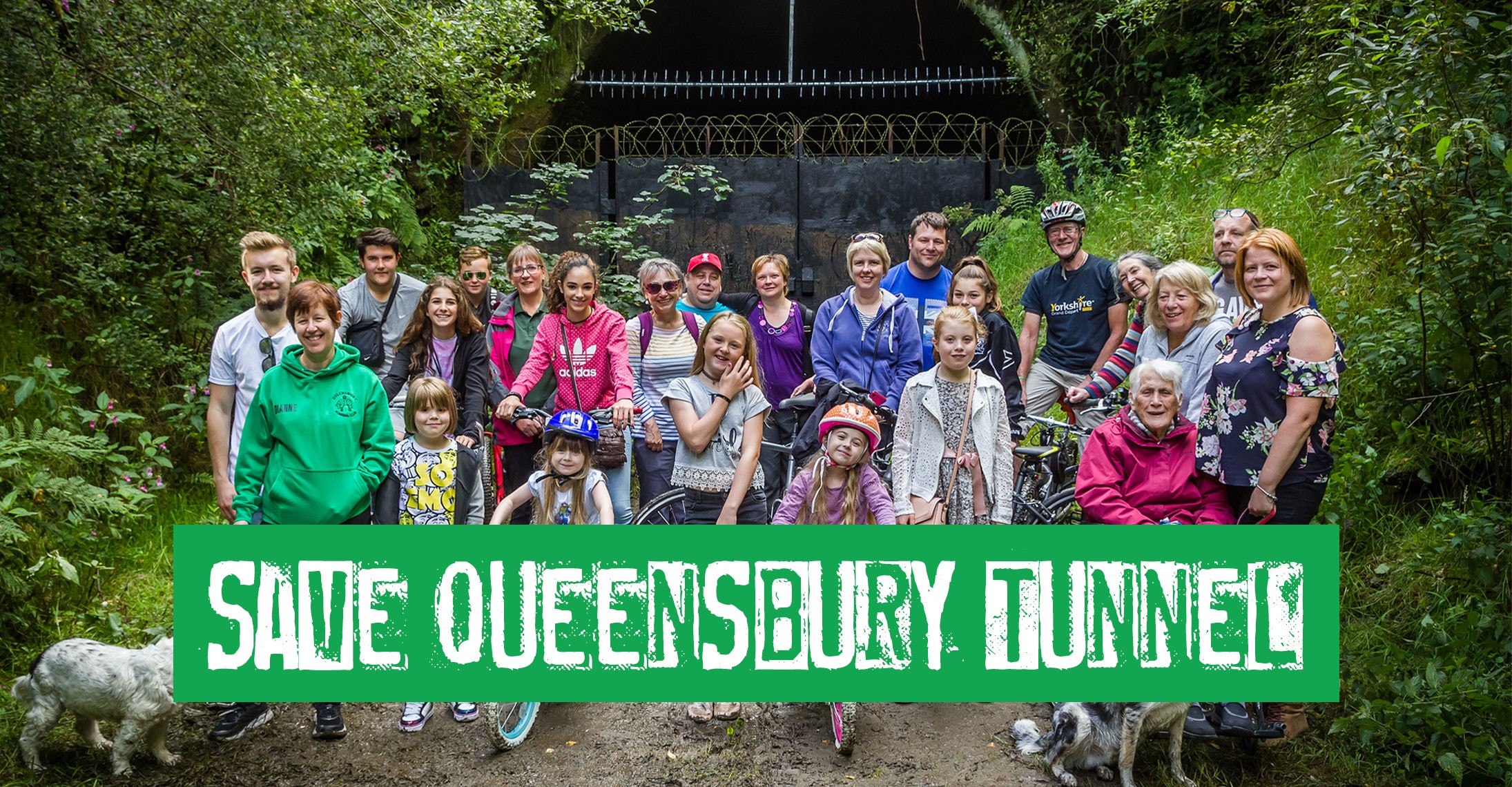 Local people outside one of the Queensbury Tunnel entrances with a banner image across the photo saying 'Save Queensbury Tunnel'
