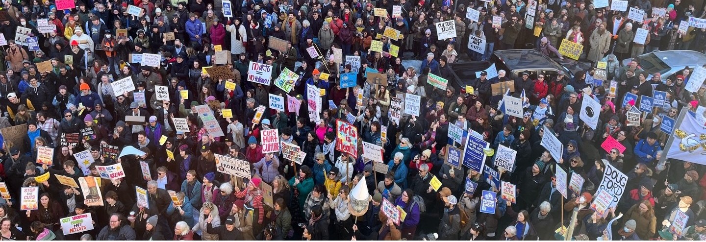 The view from inside Province House, looking out on the Granville Street side, thousands of people have gathered to protest the government's budget.