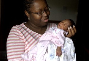 Black_Parent_Holds_Black_Child_AP_Photo_M_Spencer_Green_