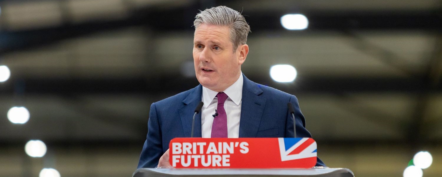 Keir Starmer at lectern with sign: Britain's Future