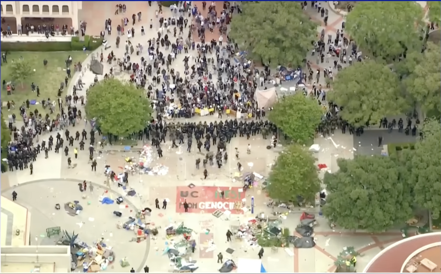 View of hundreds of police officers clearing out a peaceful protest encampment at UC Irvine on May 15, 2024