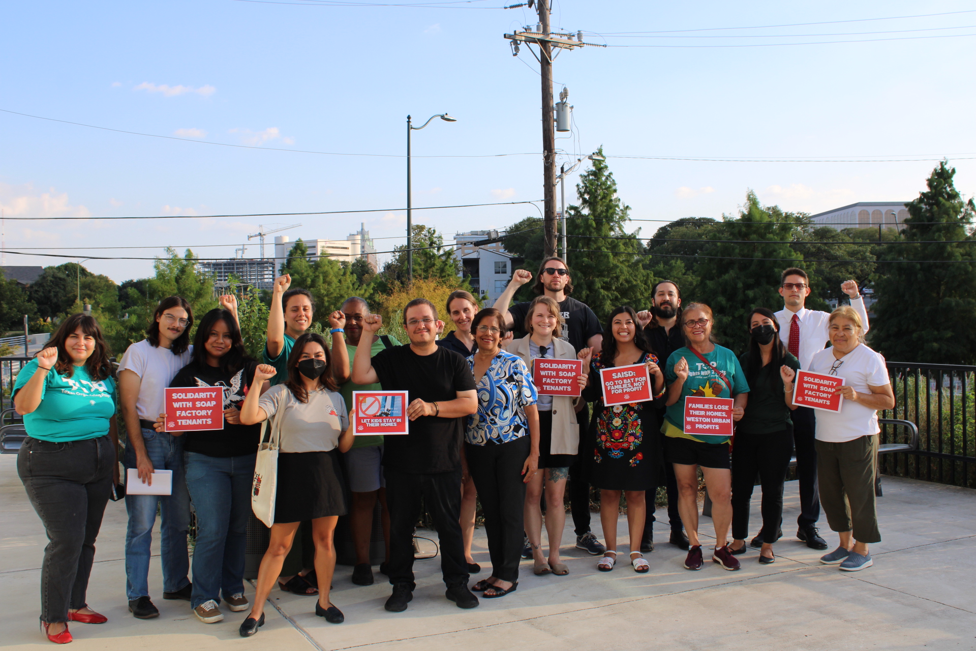 Residents of the Soap Factory Apartments and Members of the Schools Our Students Deserve Coalition outside of the SAISD Central after a school board meeting