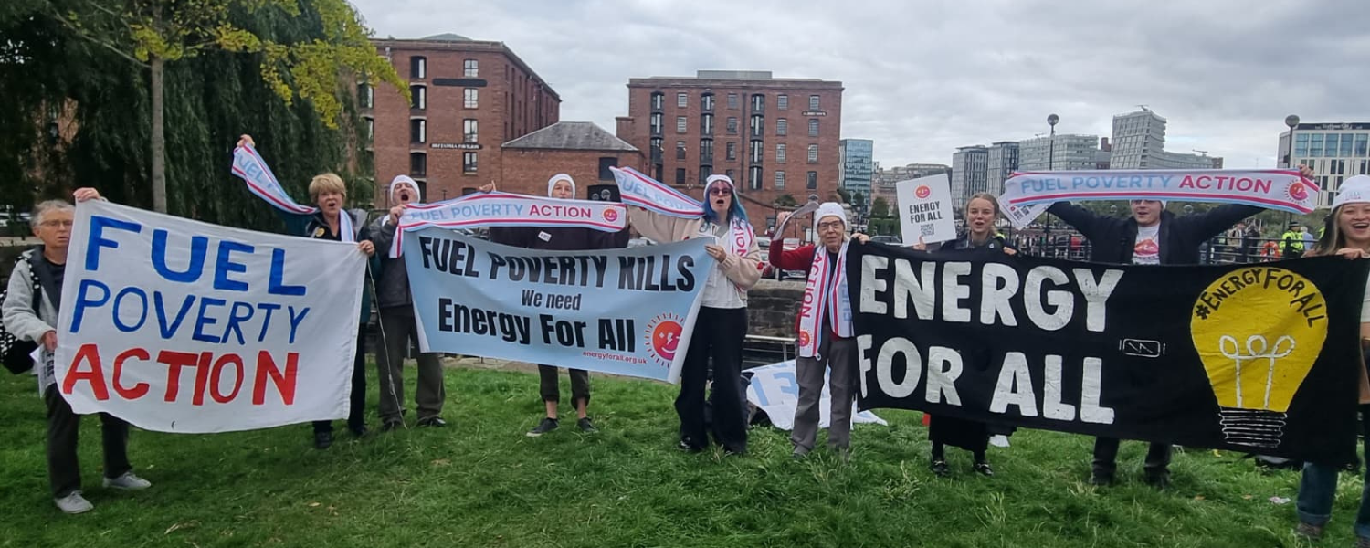 Protestors hold Fuel Poverty Action and Energy For All banners.