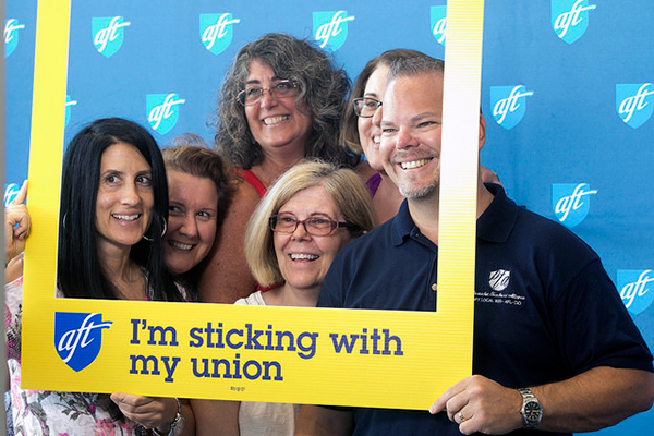 Photo of convention participants at photo booth
