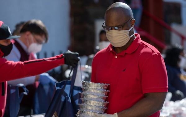 Jamaal handing out food