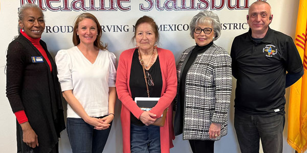 Federation of Indian Service Employees President Sue Parton, center, stands with U.S. Rep. Melanie Stansbury (D-N.M.), second from left, along with federal employees and activists.