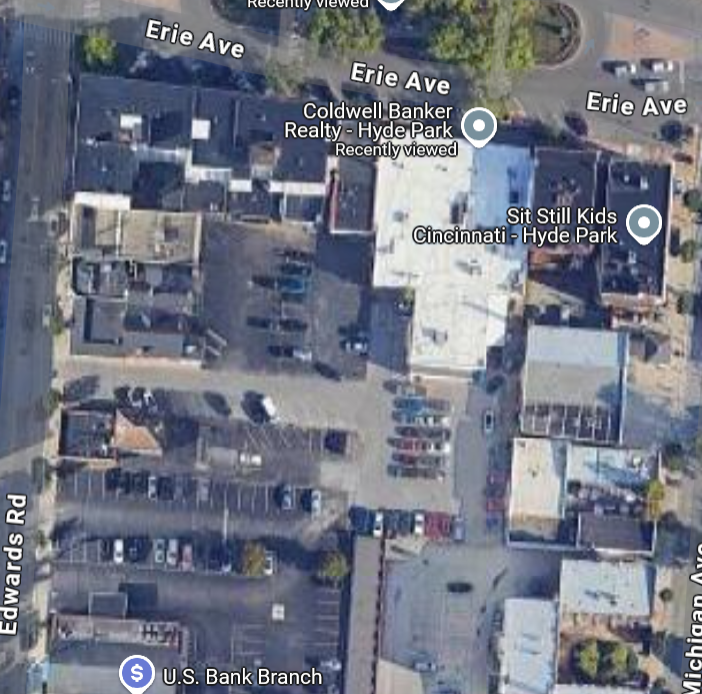 A satellite view of the development site, which shows an extensive and underutilized parking lot.