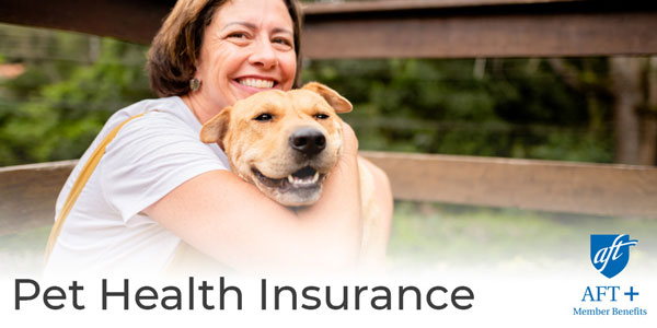 Smiling woman holding a dog