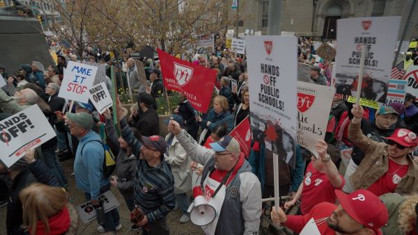 Big crowd of protesters with signs