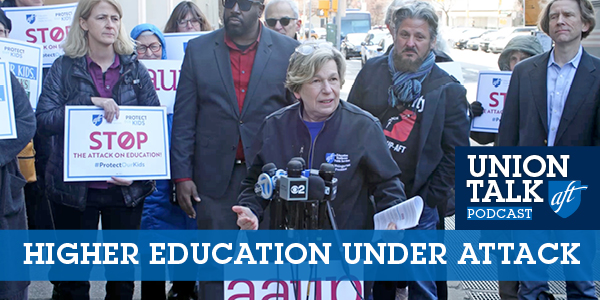 Randi Weingarten at the mic with other protesters behind her