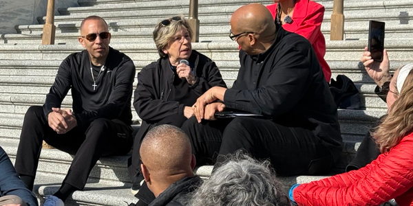 Randi Weingarten on steps of Capitol with Hakeem Jeffries and Cory Booker