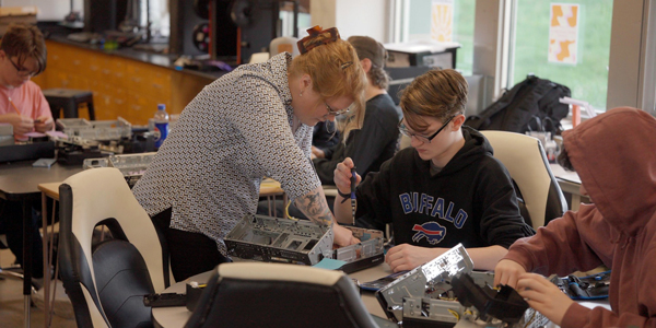 Students working on the electronic aspects of a computer