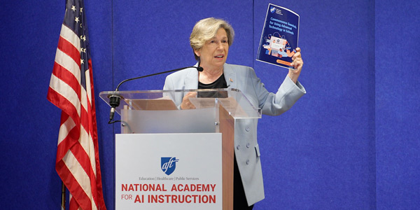 Randi Weingarten at a podium with the words "National Academy of AI Instruction"