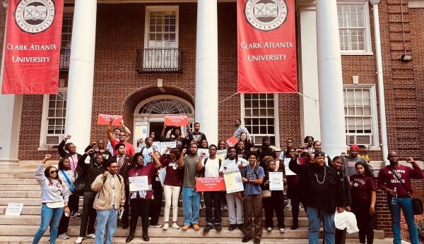 Crowd of students on steps with Clark Atlanta University banners