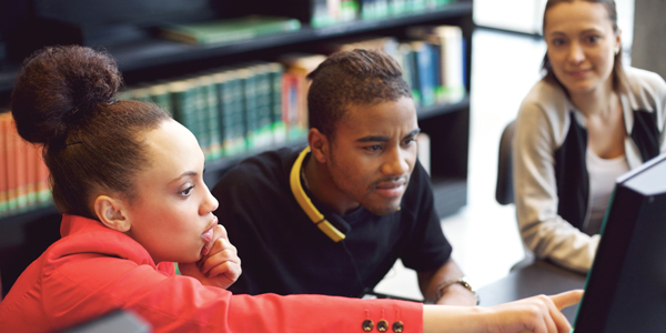 Two students working together at a computer