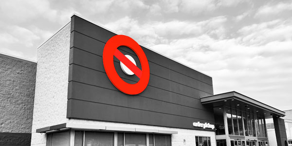 Picture of a big box store with the giant logo crossed out