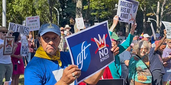 Protest crowd in North Carolina with a sign, "AFT No Kings"
