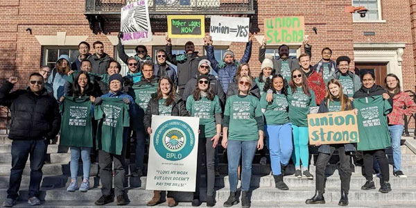 A crowd of Brown University Labor Organization with a signs like "Union Strong" and "Union=Yes"