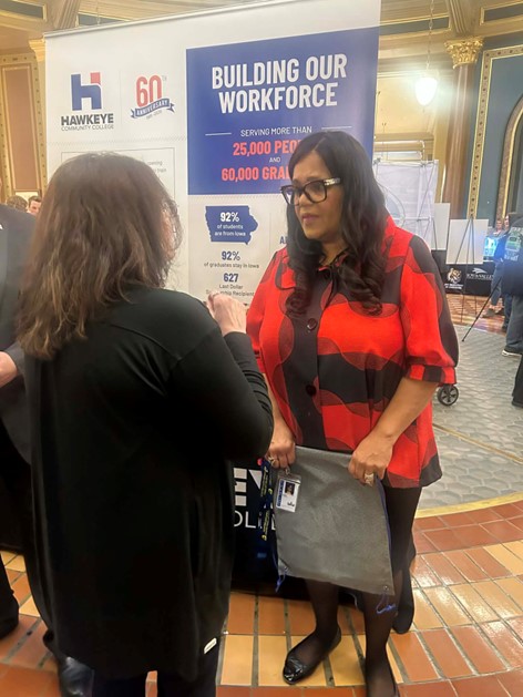Senator Hardman speaking with a representative from Hawkeye Community College in the Capitol Rotunda on Community College Day on the Hill.