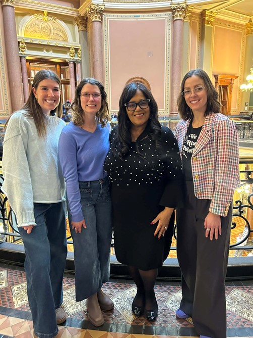 Senator Hardman standing with two Speech-Language Pathologists and one student outside the Senate chamber.