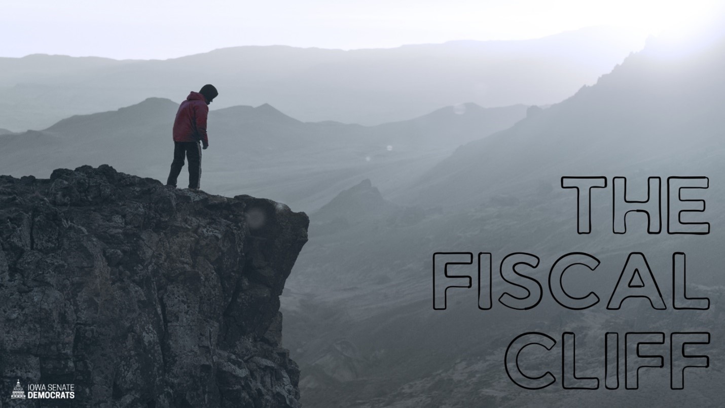 A person looking over the edge of a cliff with text that reads, “The Fiscal Cliff” A person looking over the edge of a cliff with text that reads, “The Fiscal Cliff”