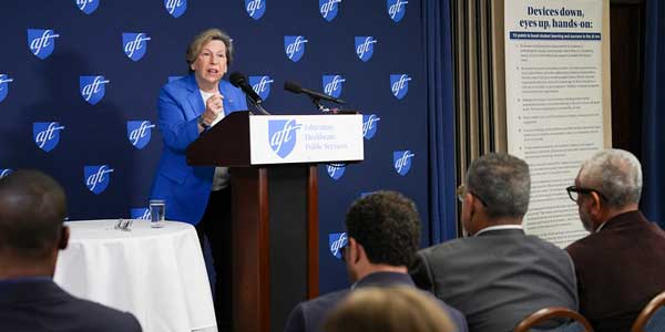 Randi Weingarten speaks at a podium. Randi Weingarten speaks at a podium.