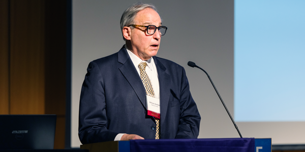 A man stands at a podium.
