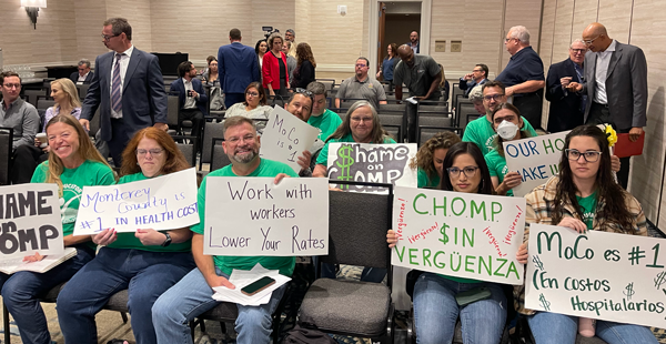 Group of union members holding signs Group of union members holding signs