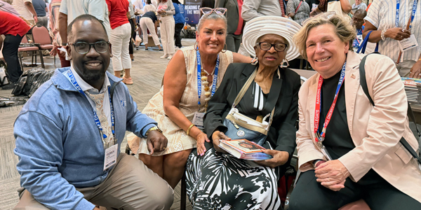 AFT officers pose with a Shiloh church member. AFT officers pose with a Shiloh church member.