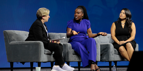 Randi Weingarten, Tiffany Aliche and Aissa Canchola Bañez sit on stage having a discussion in front of an audience at the AFT convention. Randi Weingarten, Tiffany Aliche and Aissa Canchola Bañez sit on stage having a discussion in front of an audience at the AFT convention.