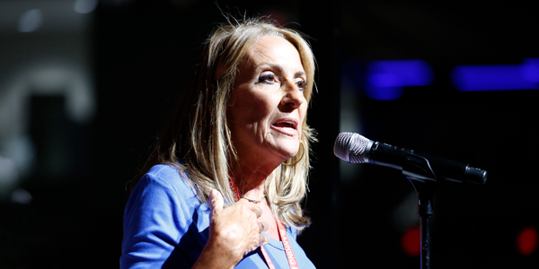 Debbie White, president of New Jersey’s Health Professionals and Allied Employees, speaks at a microphone during the collective bargaining session at the AFT’s national convention. Debbie White, president of New Jersey’s Health Professionals and Allied Employees, speaks at a microphone during the collective bargaining session at the AFT’s national convention.